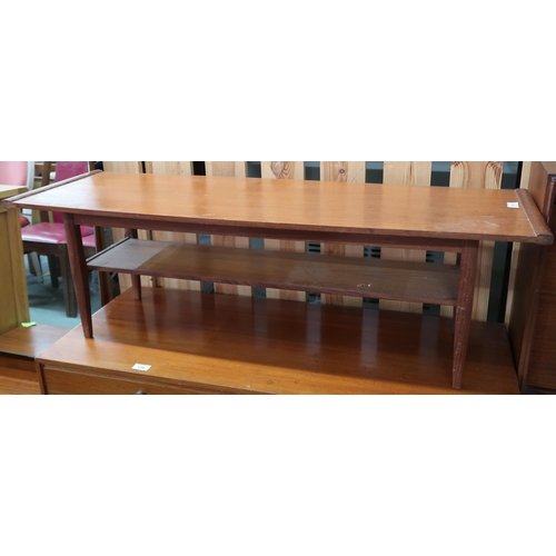 113 - A mid 20th century teak two tier coffee table on square tapering supports, 36cm high x 114cm long x ... 