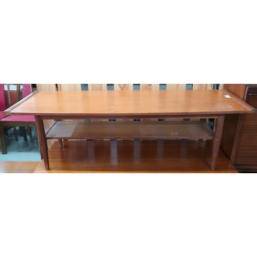 113 - A mid 20th century teak two tier coffee table on square tapering supports, 36cm high x 114cm long x ... 