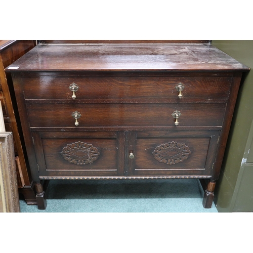 123 - A 20th century stained oak dresser with two long drawers over cabinet doors on turned supports, 79cm... 