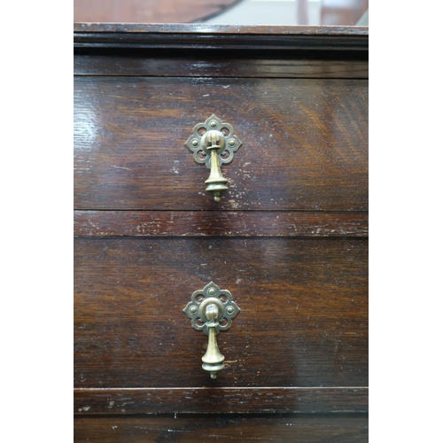 123 - A 20th century stained oak dresser with two long drawers over cabinet doors on turned supports, 79cm... 