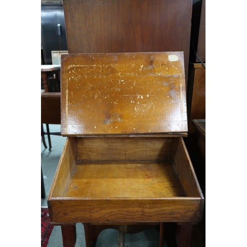 126 - A 20th century elm children's school desk with integrated stool, 71cm high x 47cm wide x 70cm deep