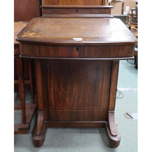 127 - A Victorian walnut Davenport desk with hinged top stationary compartment over embossed skiver over f... 