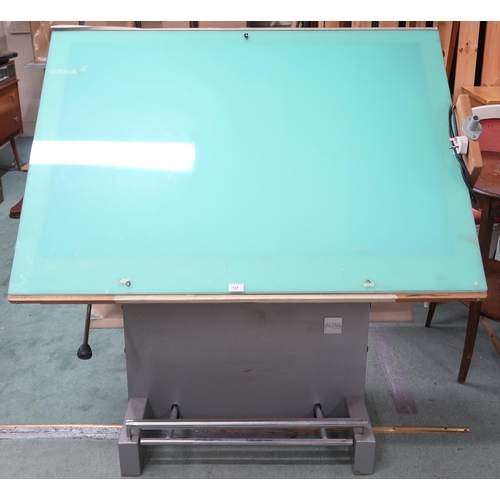 137 - A 20th century Alpia Besancon drafting table with adjustable top with integrated light box on rise a... 