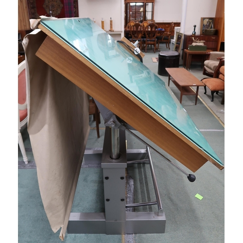 137 - A 20th century Alpia Besancon drafting table with adjustable top with integrated light box on rise a... 