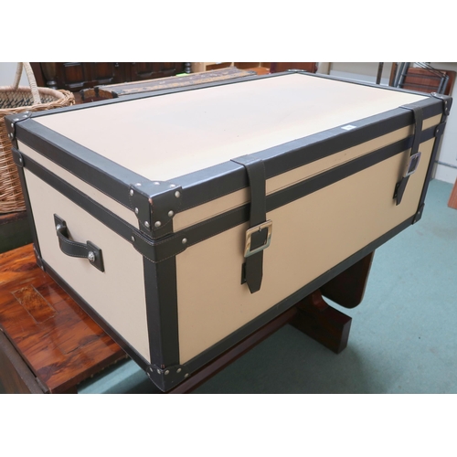 150 - A contemporary leather bound trunk with canvas lined exterior, 42cm high x 112cm wide x 61cm deep