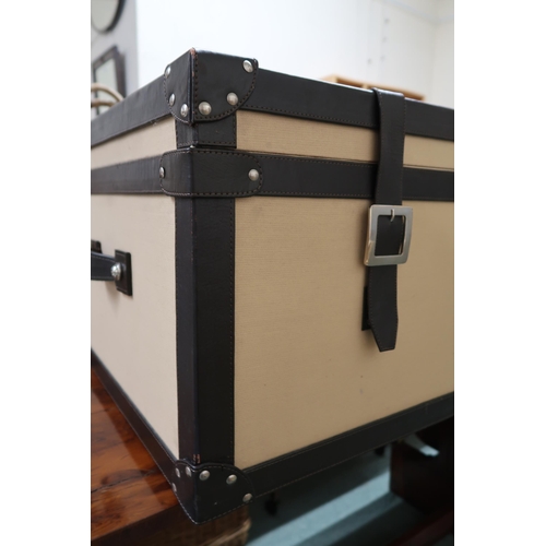 150 - A contemporary leather bound trunk with canvas lined exterior, 42cm high x 112cm wide x 61cm deep