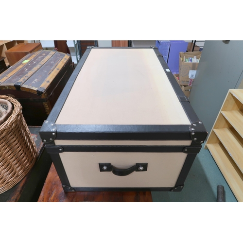 150 - A contemporary leather bound trunk with canvas lined exterior, 42cm high x 112cm wide x 61cm deep