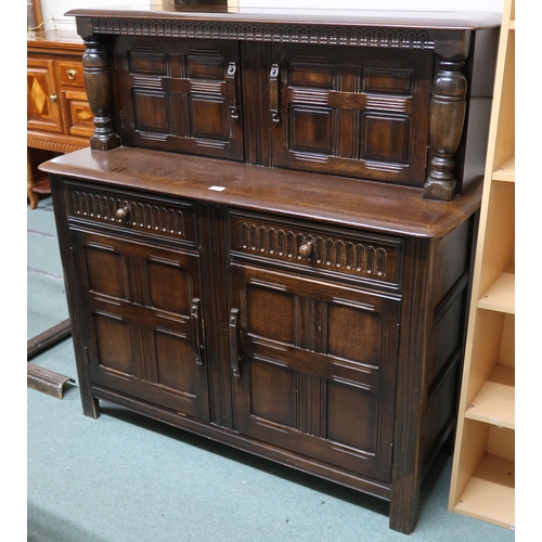 152 - A mid 20th century Priory sideboard with pair of cabinet doors over pair of drawers over pair of pan... 