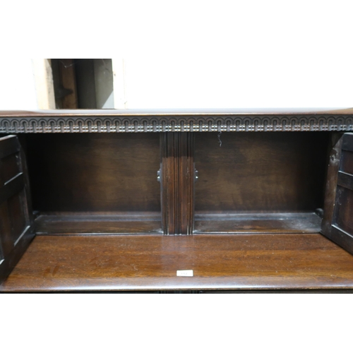 152 - A mid 20th century Priory sideboard with pair of cabinet doors over pair of drawers over pair of pan... 