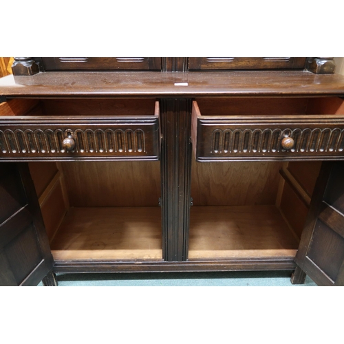 152 - A mid 20th century Priory sideboard with pair of cabinet doors over pair of drawers over pair of pan... 