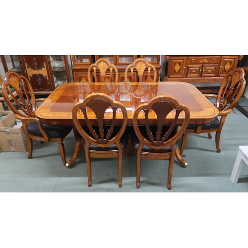 157 - A 20th century reproduction mahogany and maple inlaid dining suite consisting twin pedestal extendin... 