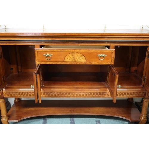 157 - A 20th century reproduction mahogany and maple inlaid dining suite consisting twin pedestal extendin... 