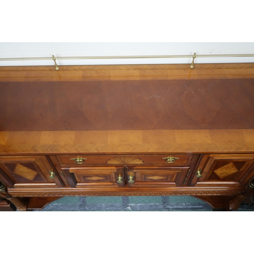 157 - A 20th century reproduction mahogany and maple inlaid dining suite consisting twin pedestal extendin... 