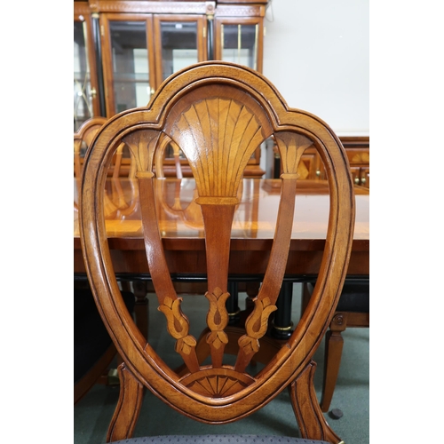 157 - A 20th century reproduction mahogany and maple inlaid dining suite consisting twin pedestal extendin... 