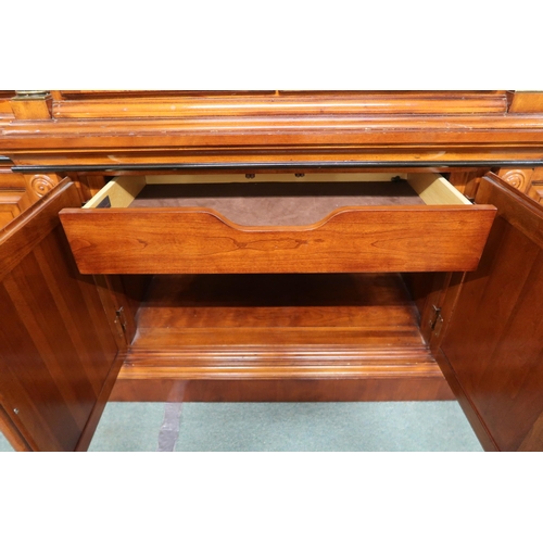 158 - A 20th century reproduction mahogany and maple inlaid breakfront display cabinet with cornice over f... 