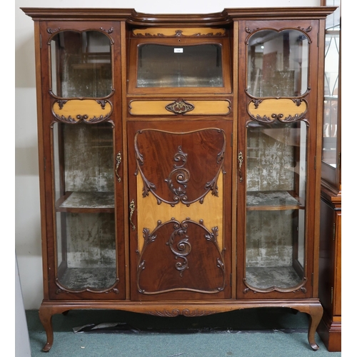 159 - A 20th century mahogany art nouveau style display cabinet with shaped top over central glazed fall f... 