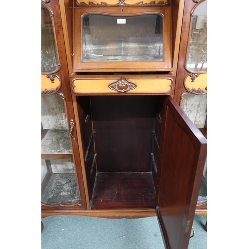 159 - A 20th century mahogany art nouveau style display cabinet with shaped top over central glazed fall f... 