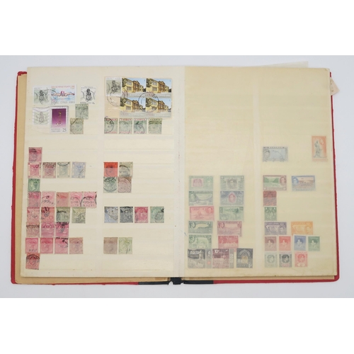 497 - STAMPS a collection of stamps in albums with mixed British, colonies to include Malta, Jamaica, Nata... 