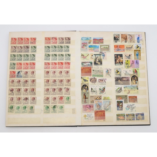 497 - STAMPS a collection of stamps in albums with mixed British, colonies to include Malta, Jamaica, Nata... 