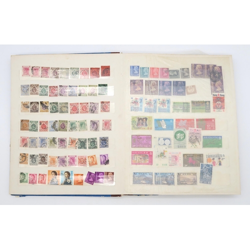 497 - STAMPS a collection of stamps in albums with mixed British, colonies to include Malta, Jamaica, Nata... 