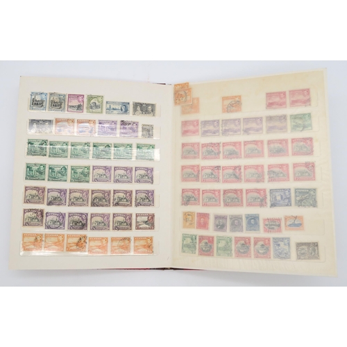 497 - STAMPS a collection of stamps in albums with mixed British, colonies to include Malta, Jamaica, Nata... 