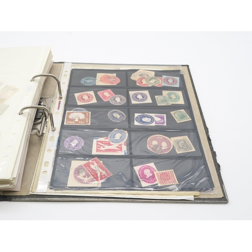 497A - A collection of USA stamps, with various commemorative and older examples, housed in a ring-bound fo... 