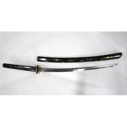 531 - A Japanese katana with folded steel blade and cast brass tsuba, the blade measuring approx. 70cm in ... 