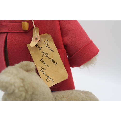 543 - A Paddington teddy bear by Gabrielle Designs, wearing red felt coat and Dunlop Wellington boots, ret... 