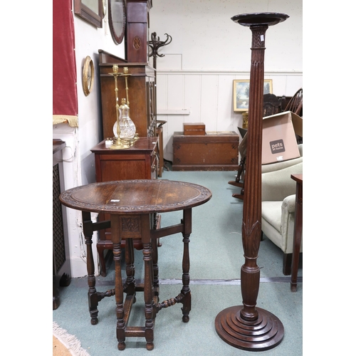 63 - A 20th century mahogany torchiere stand with circular top on reeded column on stepped base, 153cm hi... 