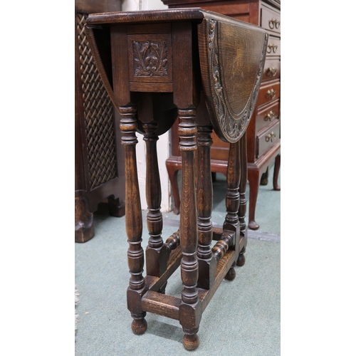 63 - A 20th century mahogany torchiere stand with circular top on reeded column on stepped base, 153cm hi... 