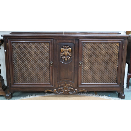 64 - A 20th century mahogany reproduction cabinet with pair of doors with metallic wire lattice panel fro... 