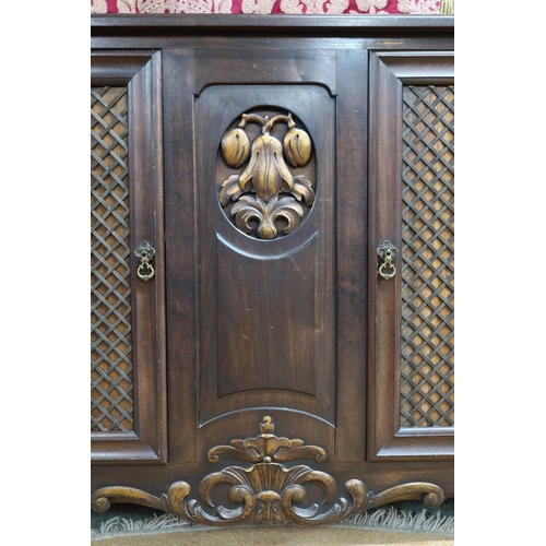 64 - A 20th century mahogany reproduction cabinet with pair of doors with metallic wire lattice panel fro... 