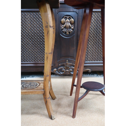 67 - An early 20th century oriental hardwood two tier occasional table with carved top on carved faux bam... 