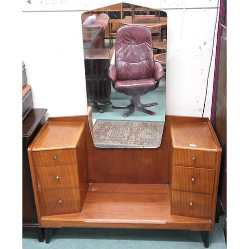 73 - A 20th century teak mirror backed dressing table with central mirror flanked by banks of three drawe... 