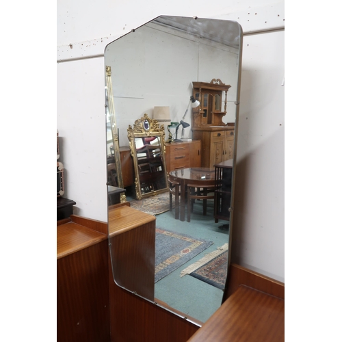 73 - A 20th century teak mirror backed dressing table with central mirror flanked by banks of three drawe... 