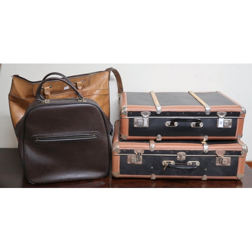 74 - A graduating pair of wood bound travel cases, St Michael faux leather bag and another brown vinyl ba... 