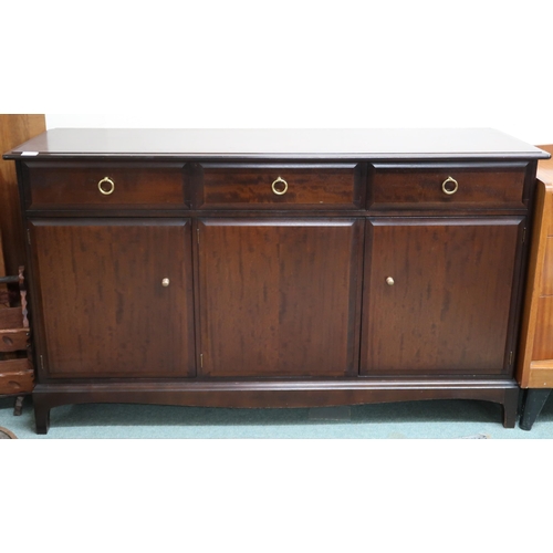 76 - A mid 20th century Stag minstrel sideboard with three drawers over three cabinet doors, 81cm high x ... 