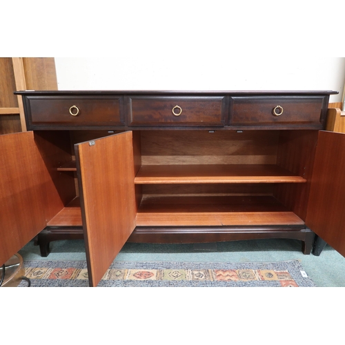 76 - A mid 20th century Stag minstrel sideboard with three drawers over three cabinet doors, 81cm high x ... 