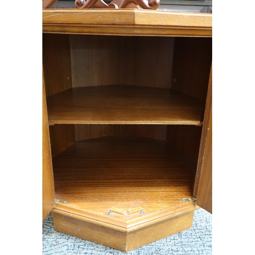 78 - A 20th century octagonal two door cabinet and two assorted dressing mirrors (3)