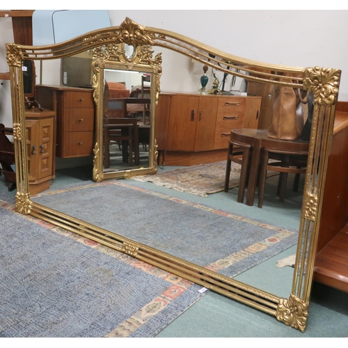 79 - A large 20th century gilt framed over mantel mirror, 114cm high x 185cm wide and a modern standard l... 