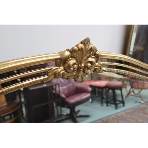 79 - A large 20th century gilt framed over mantel mirror, 114cm high x 185cm wide and a modern standard l... 