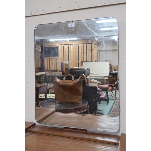 80 - A mid 20th century teak mirror backed dressing table with central mirror over tambour drawer flanked... 