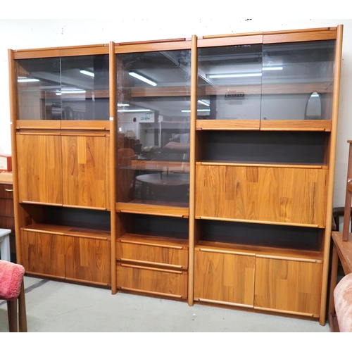 86 - A 20th century stained teak media unit, 198cm high x 255cm wide x 53cm deep