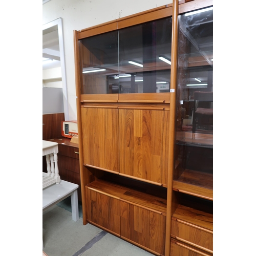 86 - A 20th century stained teak media unit, 198cm high x 255cm wide x 53cm deep