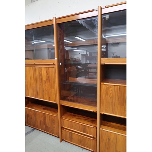 86 - A 20th century stained teak media unit, 198cm high x 255cm wide x 53cm deep