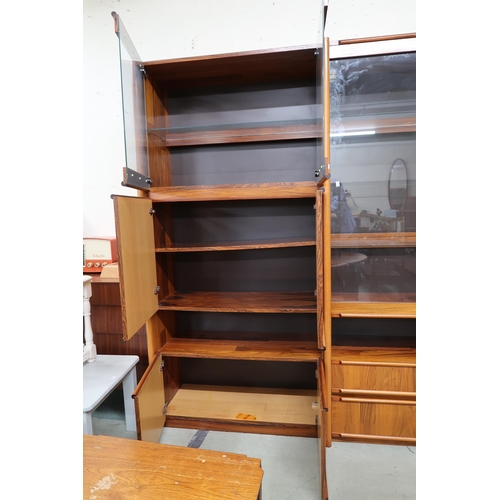 86 - A 20th century stained teak media unit, 198cm high x 255cm wide x 53cm deep