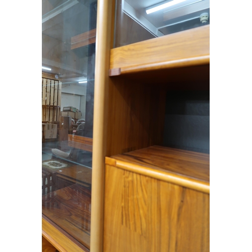 86 - A 20th century stained teak media unit, 198cm high x 255cm wide x 53cm deep