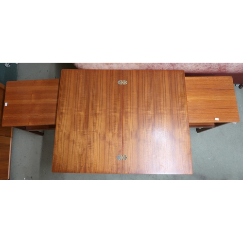 90 - A mid 20th century teak two tier fold over tea table and two accompanying occasional tables (3)