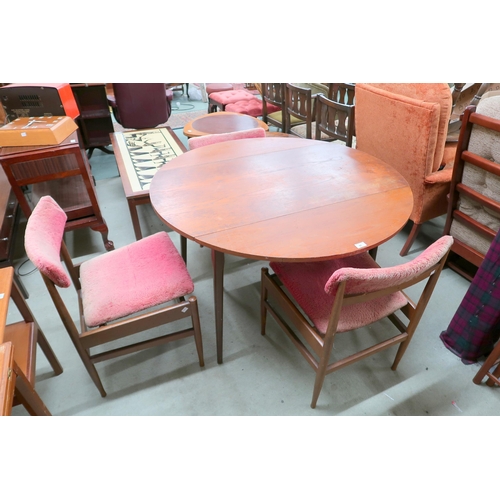 91 - A mid 20th century teak circular drop side dining table and three chairs (4)