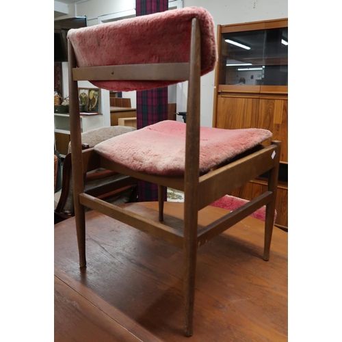 91 - A mid 20th century teak circular drop side dining table and three chairs (4)